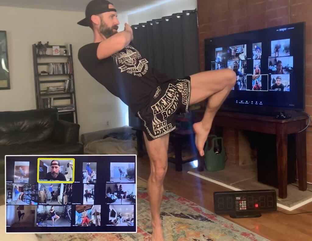 Kru Dave demonstrating a Muay THai knee to online students.